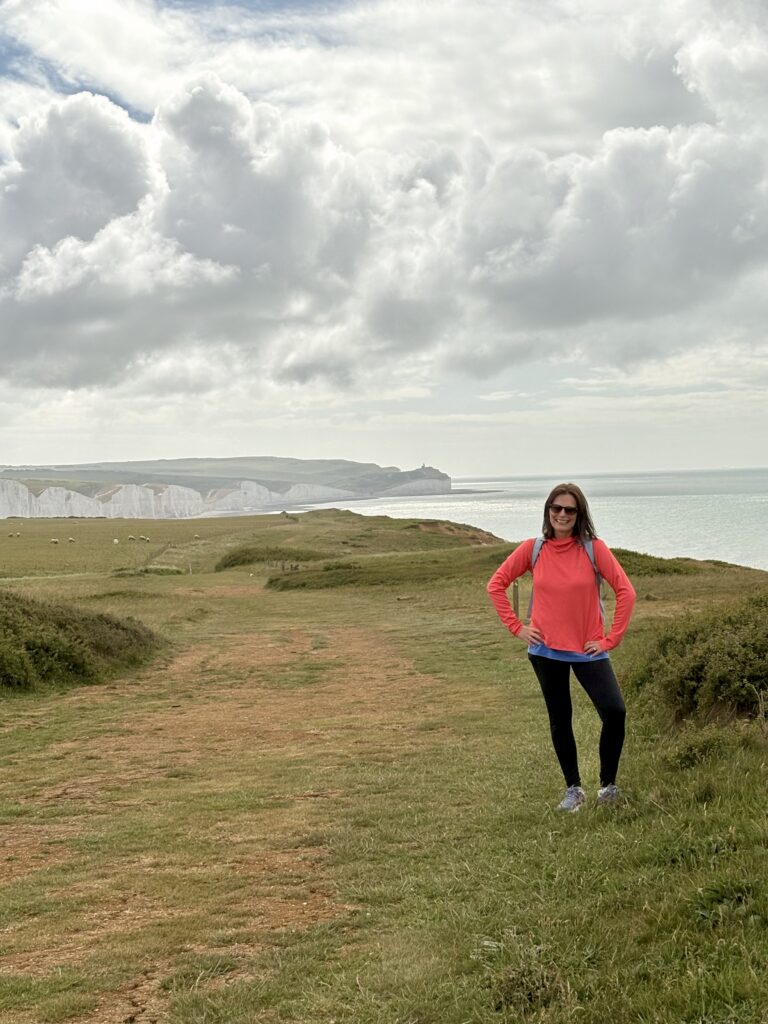 Kelly hiking near the Seven Sisters cliffs in England.